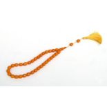 A string of amber like worry beads.