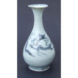 A Chinese blue & white vase decorated with a scrolling dragon chasing a flaming pearl, 24cms high.