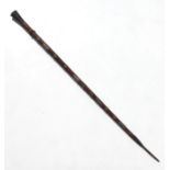 A hardwood staff with white metal handle decorated with a crucifix and crown, the shaft with