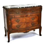A Louis XVI style walnut chest of drawers, the black marble top above an arrangement of two short