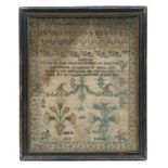 An early 19th century sampler 'Jane Ballard Aged 8, 1817' with foliate sprays, alphabet, numbers and