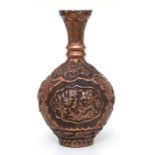 A 19th century Indo-Persian copper vase with repousse decoration, 28cms high.