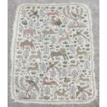 An Kashmiri Nahmda crewelwork rug decorated with animals and birds, 124 by 180cms.