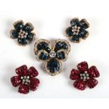 A pair of gem set silver gilt flower shaped earrings in red; together with a similar pair in blue