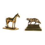 A late 19th / early 20th century brass paperweight in the form of a racehorse on a stepped