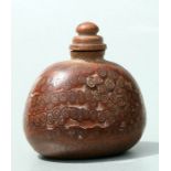 A Chinese Qing dynasty bamboo snuff bottle, 7.5cms wide.