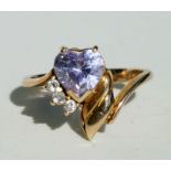 A 14ct gold dress ring set with a heart shaped pink stone and three white stones, approx UK size '