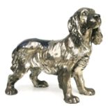 A plated spelter model of a spaniel, 28cms long.