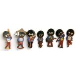 A group of Robinson's jam enamel golly badges to include a golfer, a cricketer, a scout and a