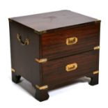 A mahogany Campaign style two-drawer bedside cabinet, 46cms wide.