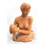 An unglazed studio pottery figure and a semi naked woman.56cm high