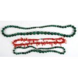 A stick coral necklace; together with two malachite bead necklaces (3).