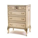 A Louis XV white painted chest of four graduated long drawers, the top drawer with central porcelain