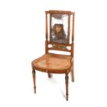 A Sheraton Revival parlour chair with painted decoration and cane back and seat.(a/f)