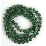 A long green hardstone bead necklace, overall length approx 118cms, bead diameter 12mm.