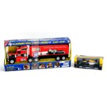 A Kenworth Sonic Hauler lorry with Champion advertising, 50cms long, boxed; and an Onyx 1:24 scale