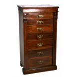 A late 19th century walnut Wellington chest with seven graduated drawers, on a plinth base, 60cms