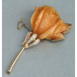A Nettie Rosenstein gilt metal brooch in the form of a rose, 10cms long.Condition Reportrose looks