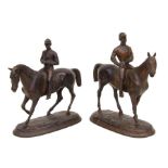 A pair of French patinated cast iron groups depicting jockeys on racehorses, each approx 22cms