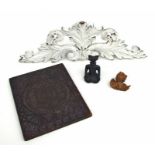 A small collection of treen items to include a carved lime wood putti, 8cms wide; an acanthus leaf