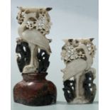 A pair of Chinese carved soapstone stands depicting a crane amongst foliage, 23.5cms high