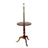 A walnut lamp table on turned column and tripod base, 52cms diameter.