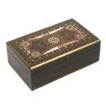 A Middle Eastern hardwood box with intricately inlaid top including Sadeli style roundels, 14cms