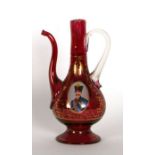 A Turkish ruby glass ewer with gilt decoration and central oval miniature depicting a military