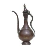 A Turkish / Islamic copper ewer or coffee pot, 50cms high.