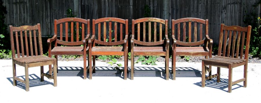 A set of six Cannock Gates teak garden chairs comprising four carvers and two chairs, all with