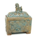 A Chinese celadon glazed incense burner, the cover with a dog of fo, 16cms wide.