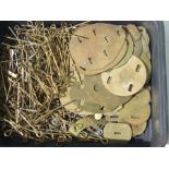 A large quantity of used brass cotter pins and brass backing plates for Military badges