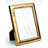 A silver gilt photo frame with Sheffield Golden Jubilee hall mark, overall 17 by 23cms.