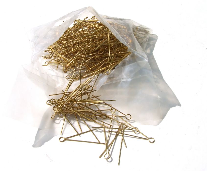A large quantity of unused 5cms (2ins) brass cotter pins for Military badges.