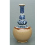 A Chinese vase, the upper section decorated with blue & white flowers and leaves above a café au