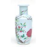 A Chinese rouleau vase decorated with flowering foliage, 22cms high.