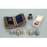 A group of silver thimbles, two boxed and one named 'Emma', various dates and makers marks (8).