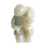 A Chinese jade / hardstone figure depicting a kneeling woman holding fruit, 4.5cms high.