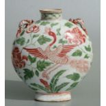 A Chinese moon flask decorated with birds amongst flowers, 23cms high.