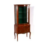 A Louis XV style display cabinet, the glazed upper section above two graduated long drawers, 62cms