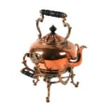 A Victorian copper kettle on stand, 38cms high.