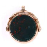 A Victorian 9ct rose gold bloodstone spinning pocket watch fob, 2.5cms wide.