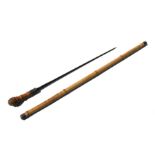 A bamboo shafted sword stick with a 53cms (20.875ins) triangular section blade. Overall length 97.