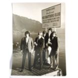 An original black & white promotional photograph of the Rolling Stones 1964, standing on a jetty