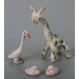 Four Bourne Denby animals designed by Donald Gilbert, a giraffe, a goose, and two ducks, the largest