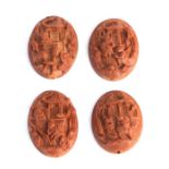 Four Chinese heido nut carvings in relief depicting Buddhist monks, each 19mm wide (4).