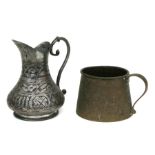 An Indo-Persian brass jug, 9cms high; together with a tinned copper jug, 16cms high (2).