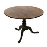 A 19th century oak tilt-top occasional table, on turned column and tripod base (reduced in