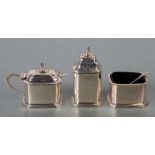 An Art Deco silver three-piece cruet set with two spoons and blue glass liners, Birmingham 1932,