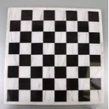 A marble chess board, 35 by 35cms.